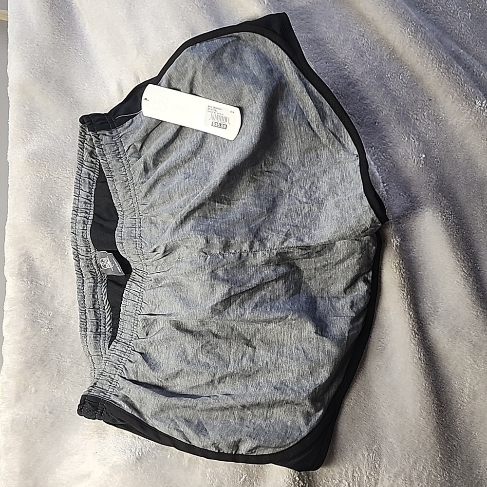 Large Daisy Fuentes bikini lined Grey and black running shorts.